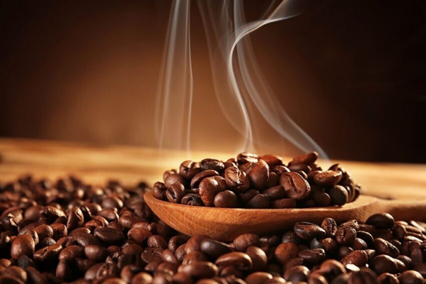 Making Smoked Coffee at Home Wooden spoon with smoked coffee beans